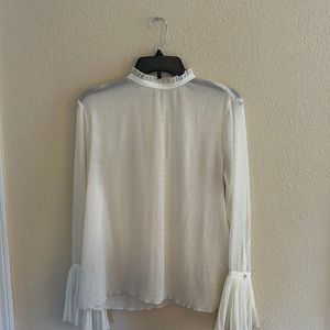 Off white top with beautiful sleeves.